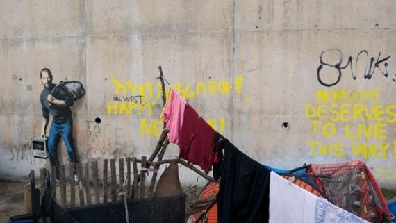 غرافيتي في فرنسا لستيف جوبز اللاجئ