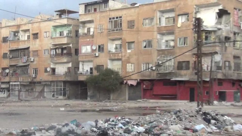 مسؤول في حكومة النظام يشرح تفاصيل إخضاع حي التضامن للقانون رقم 10