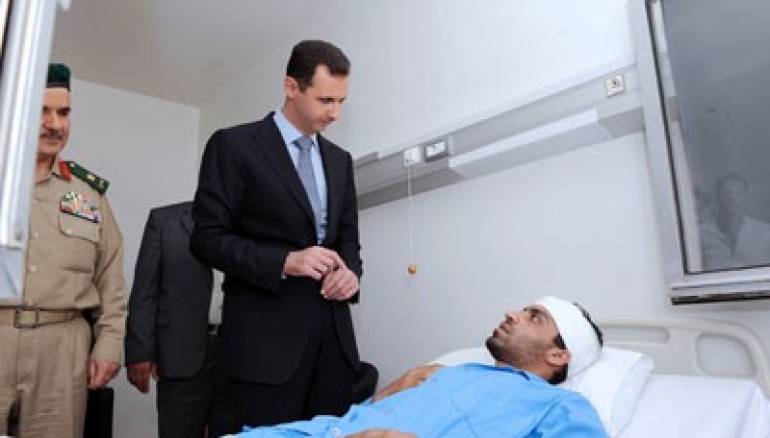 الأسد يعفي ذوي قتلى وجرحى قواته من رسوم رخص البناء