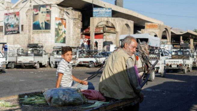 عربة يجرها خيل في العاصمة دمشق ـ "رويترز"
