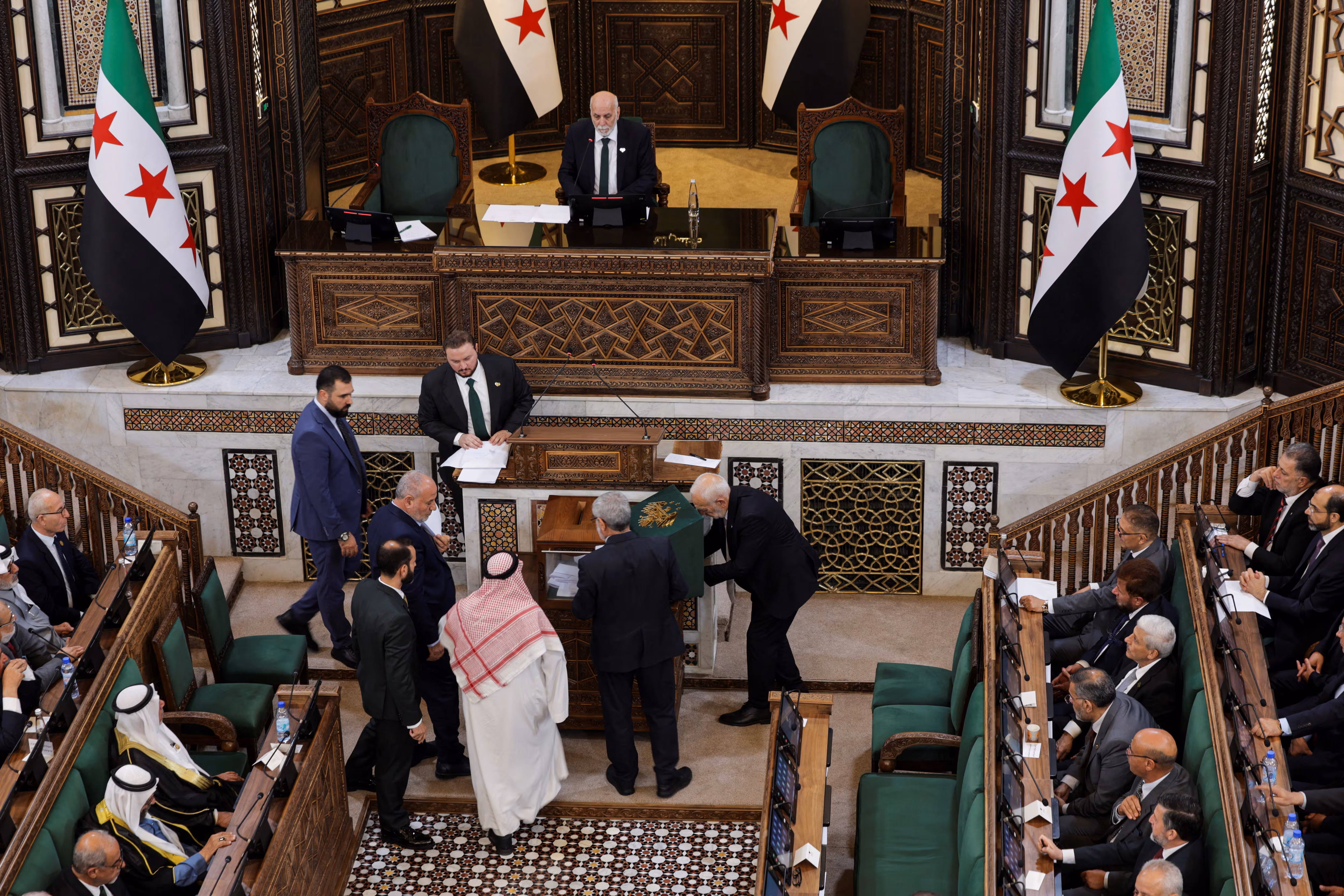 أعضاء مجلس الشعب السوري المشكل حديثا يحضرون الجلسة الافتتاحية للمجلس في دمشق يوم 12تموز/يوليو 2026. -رويترز